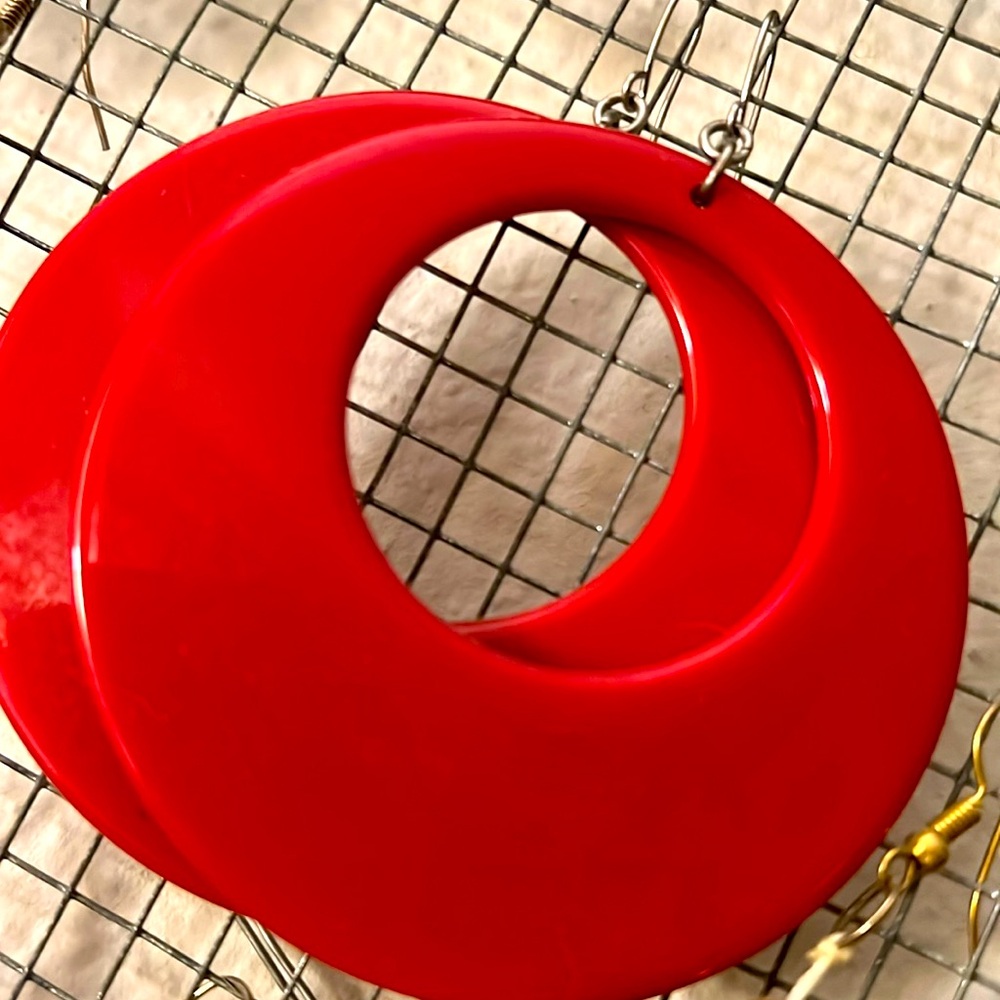 Red retro dangly go-go style earrings; statement, lightweight plastic build